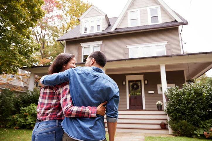 A loving couple creating simple home organizing solutions